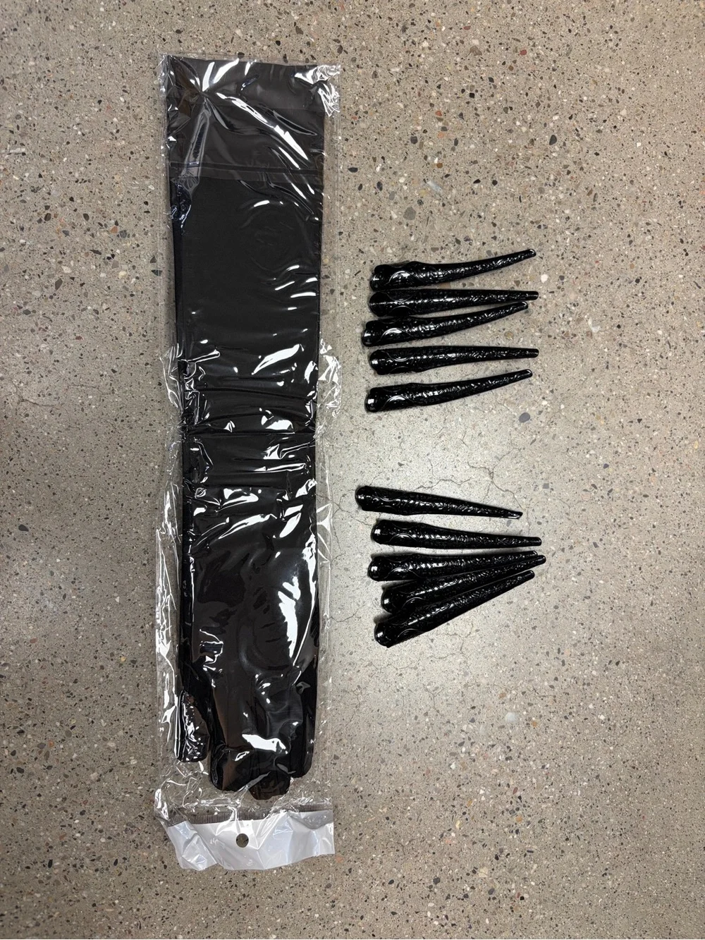 Black women’s gloves with long black finger nails